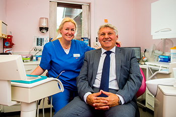 Dentist, Raminta Urbonaviciene, with Chris Davies